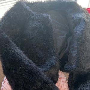 Nice black fur  coat Very nice for the winter I will keep you warm
